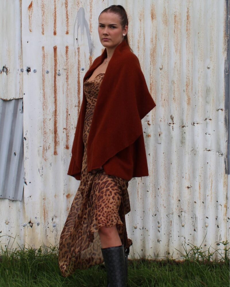 Lexi is wearing our Possum Merino Katherine Cape in our Copper colour. Beautiful and soft.